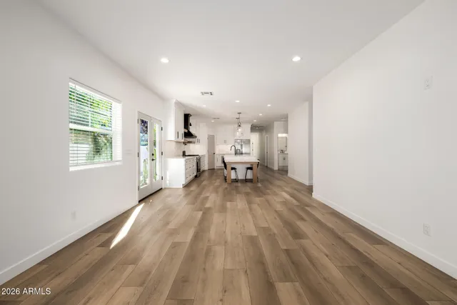 a view of a living room with wooden floor