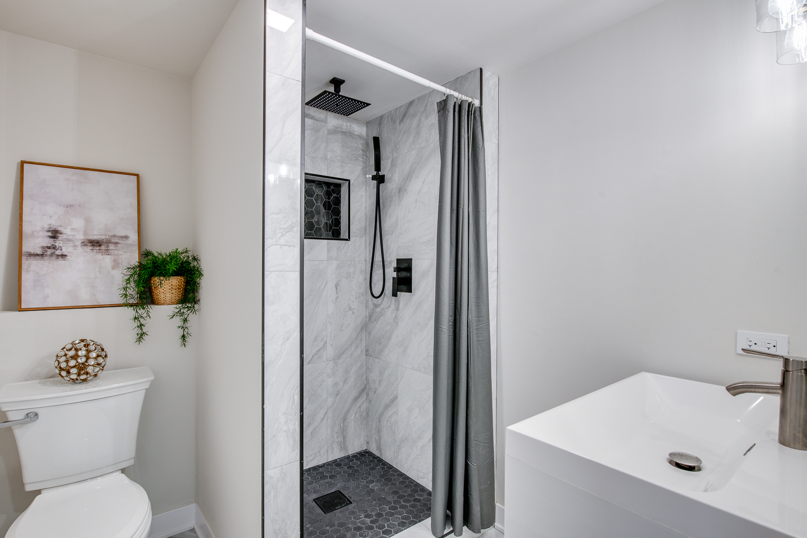 2909 Vimy Ridge Drive Joliet, IL 60435 - Photo 12 of 22 a bathroom with a sink toilet and shower