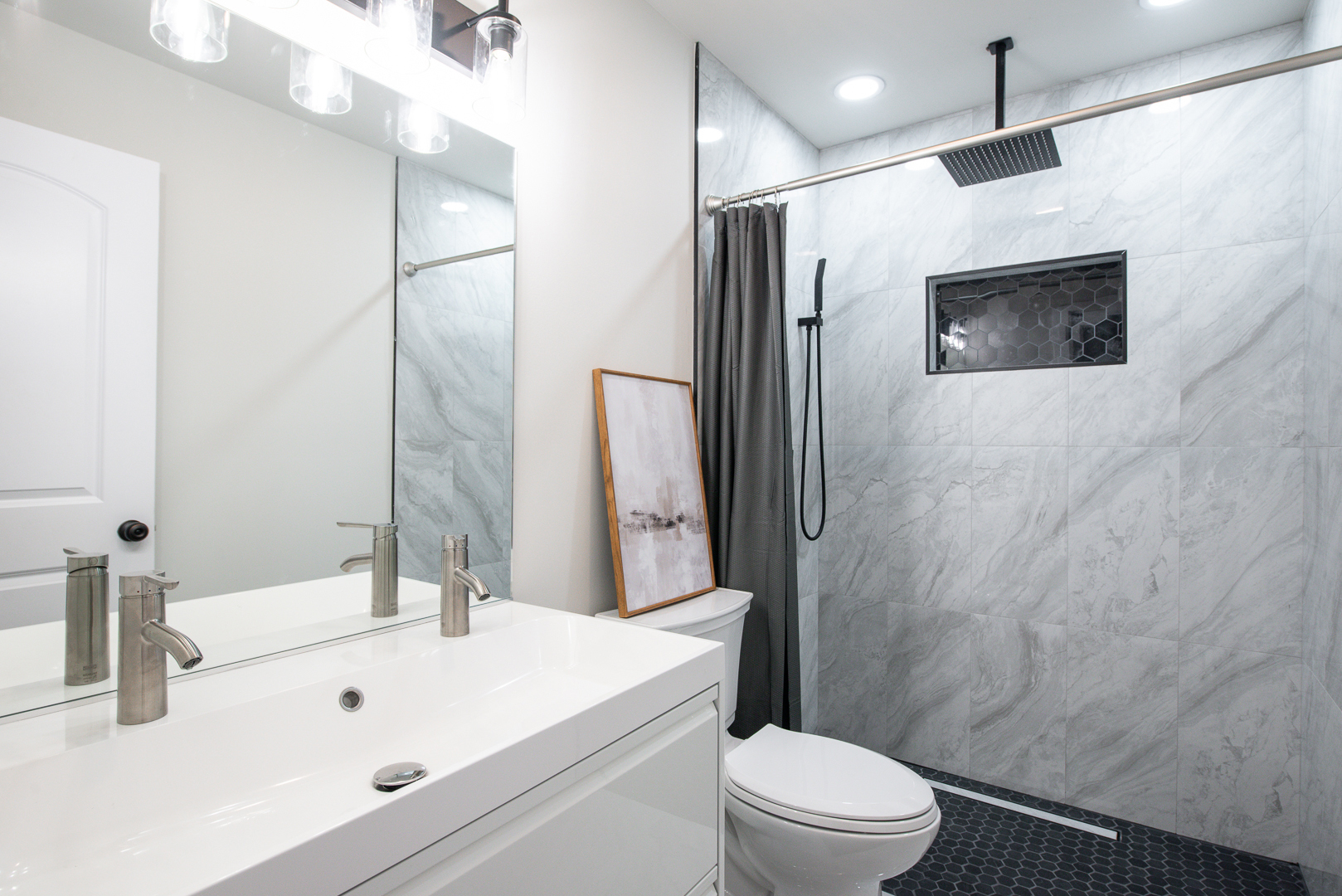 2909 Vimy Ridge Drive Joliet, IL 60435 - Photo 15 of 22 a bathroom with a sink a toilet a mirror and shower