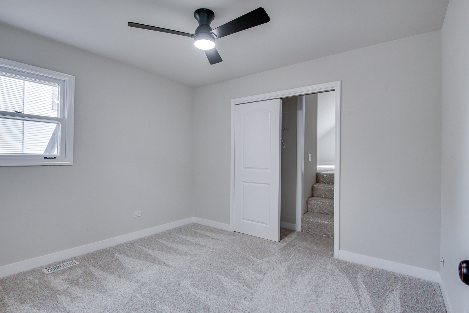 2909 Vimy Ridge Drive Joliet, IL 60435 - Photo 19 of 22 an empty room with ceiling fan and windows
