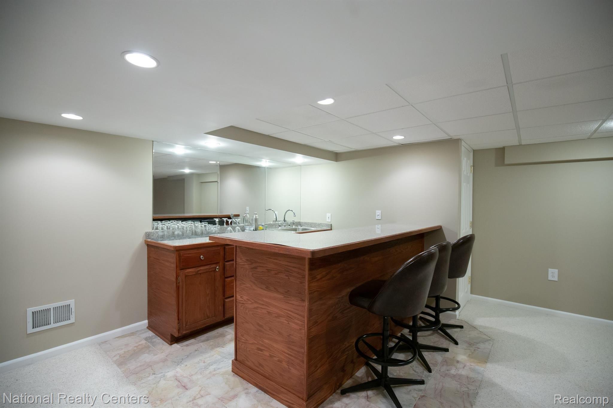 3035 Quail Ridge Circle Rochester, MI 48309 - Photo 42 of 54 Basement bar