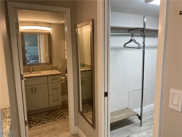 a bathroom with a shower and a sink