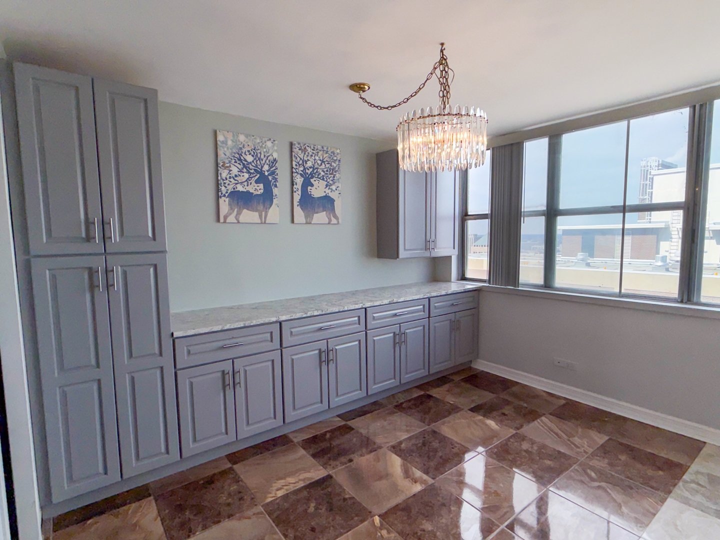 6301 North Sheridan Road, Unit 24E Chicago, IL 60660 - Photo 14 of 57 a room with granite countertop furniture and window
