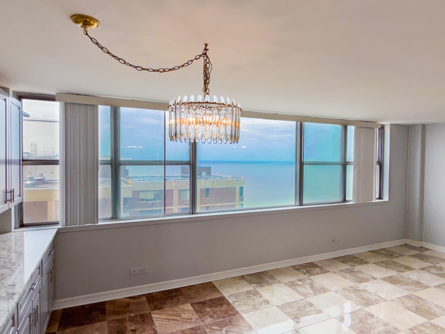 6301 North Sheridan Road, Unit 24E Chicago, IL 60660 - Photo 8 of 57 a view of a room with furniture and windows