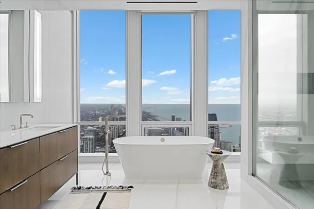 a view of a bathroom with a tub and sink
