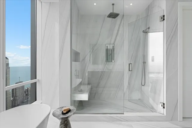 a bathroom with a shower and a toilet