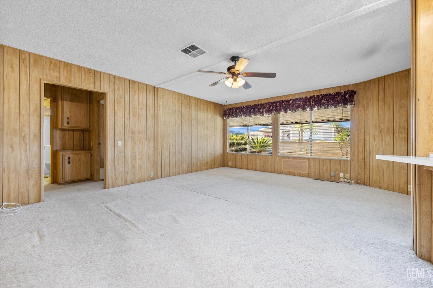 Undisclosed Address Bakersfield, CA 93306 - Photo 16 of 37 a view of an empty room with a window