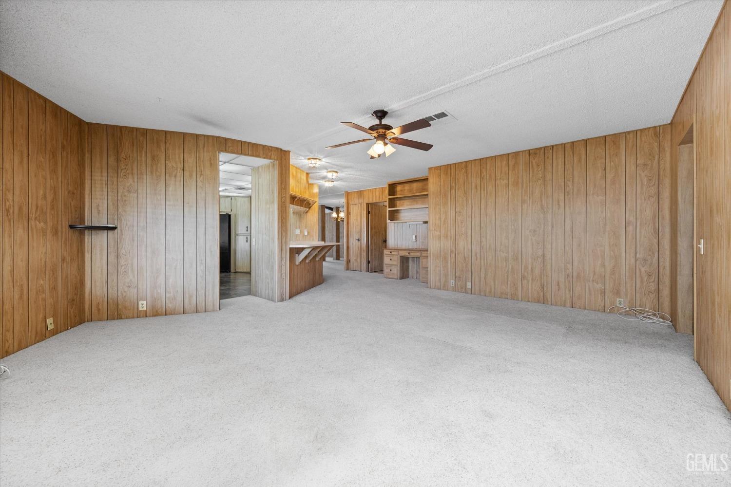 Undisclosed Address Bakersfield, CA 93306 - Photo 18 of 37 a view of an empty room with a ceiling fan