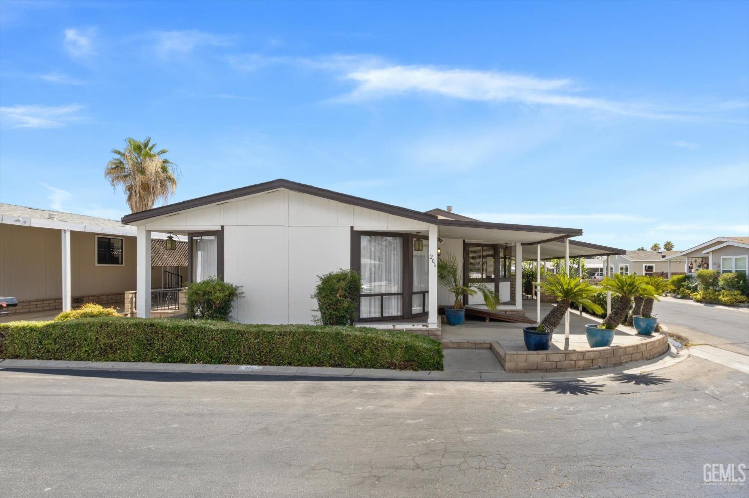 Undisclosed Address Bakersfield, CA 93306 - Photo 2 of 37 front view of a house with a patio