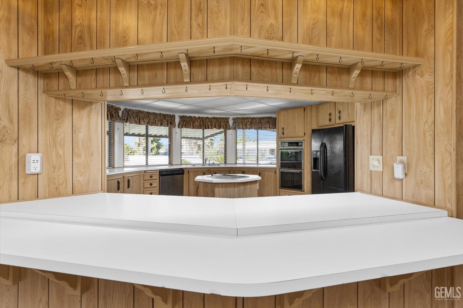 Undisclosed Address Bakersfield, CA 93306 - Photo 21 of 37 a large bedroom with a large window and kitchen view