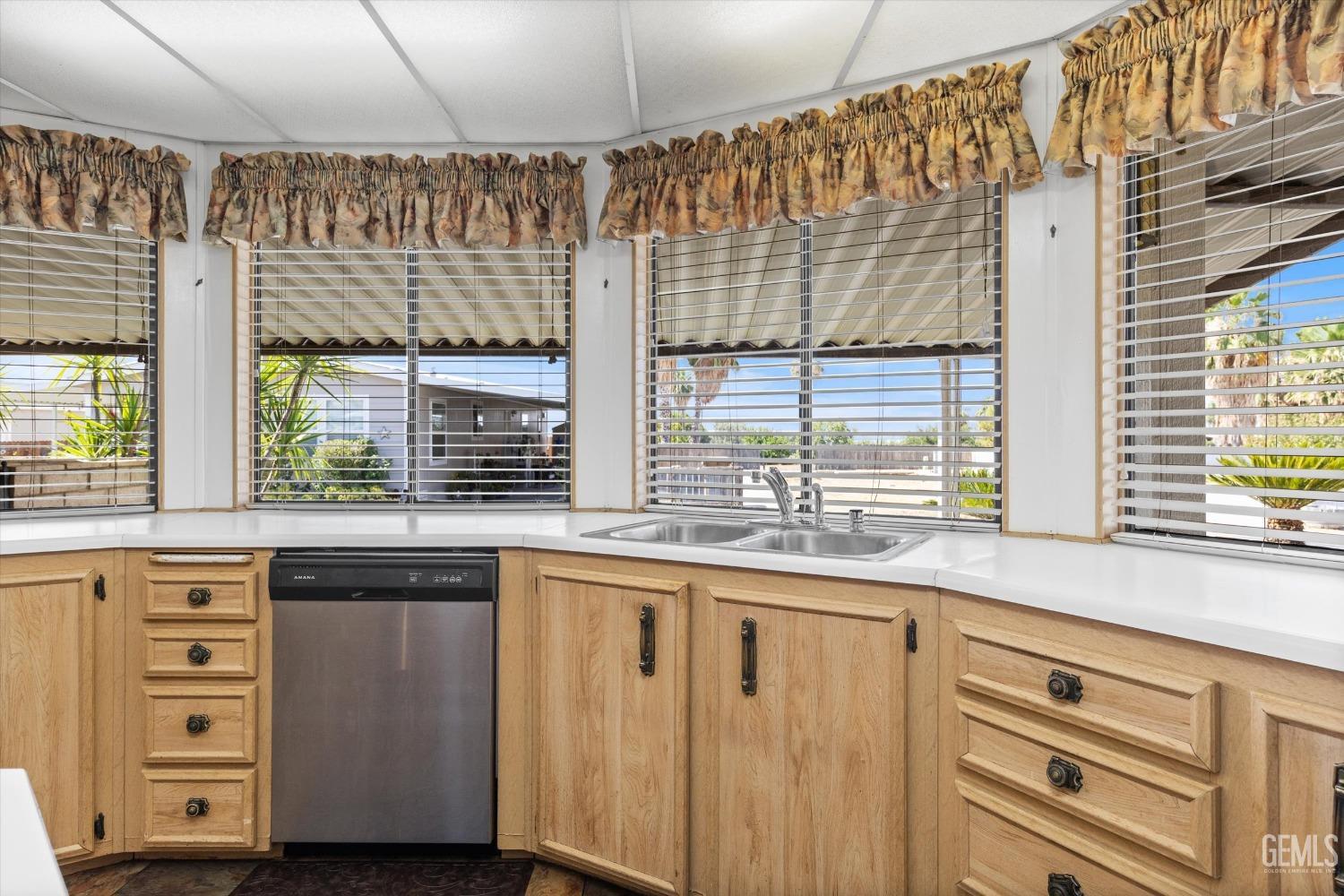 Undisclosed Address Bakersfield, CA 93306 - Photo 24 of 37 a kitchen with stainless steel appliances granite countertop a coffee maker a sink and white cabinets