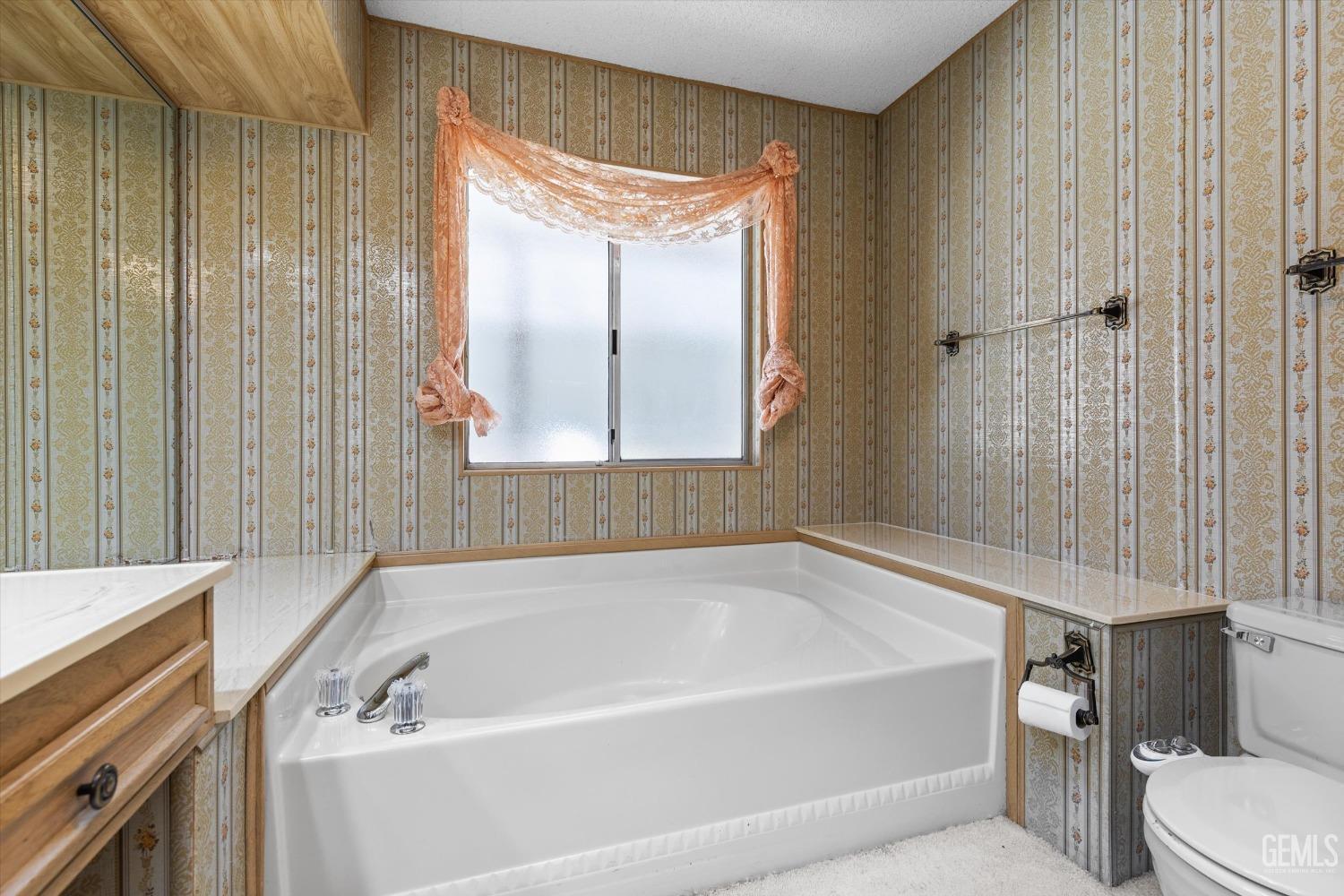 Undisclosed Address Bakersfield, CA 93306 - Photo 32 of 37 a bathroom with a tub and a window