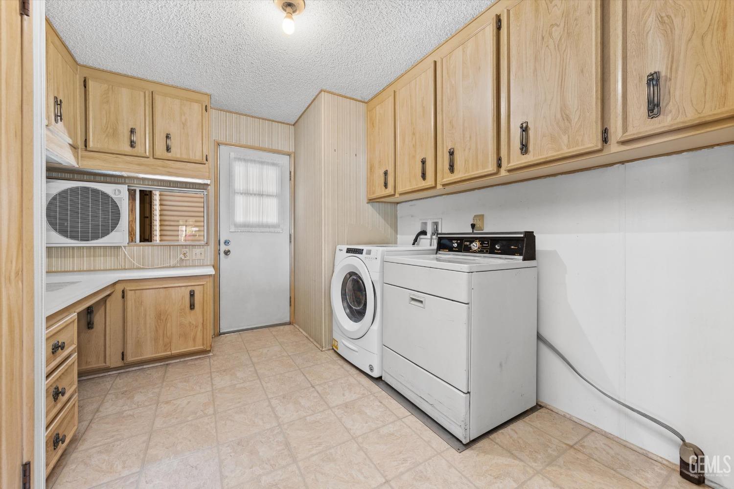 Undisclosed Address Bakersfield, CA 93306 - Photo 33 of 37 a utility room with sink dryer and washer