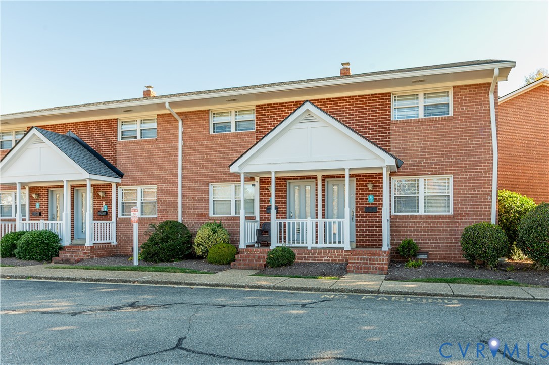 3109 North Parham Road, Unit 9 Henrico, VA 23294 - Photo 2 of 19 Traditional-style house featuring brick siding, a