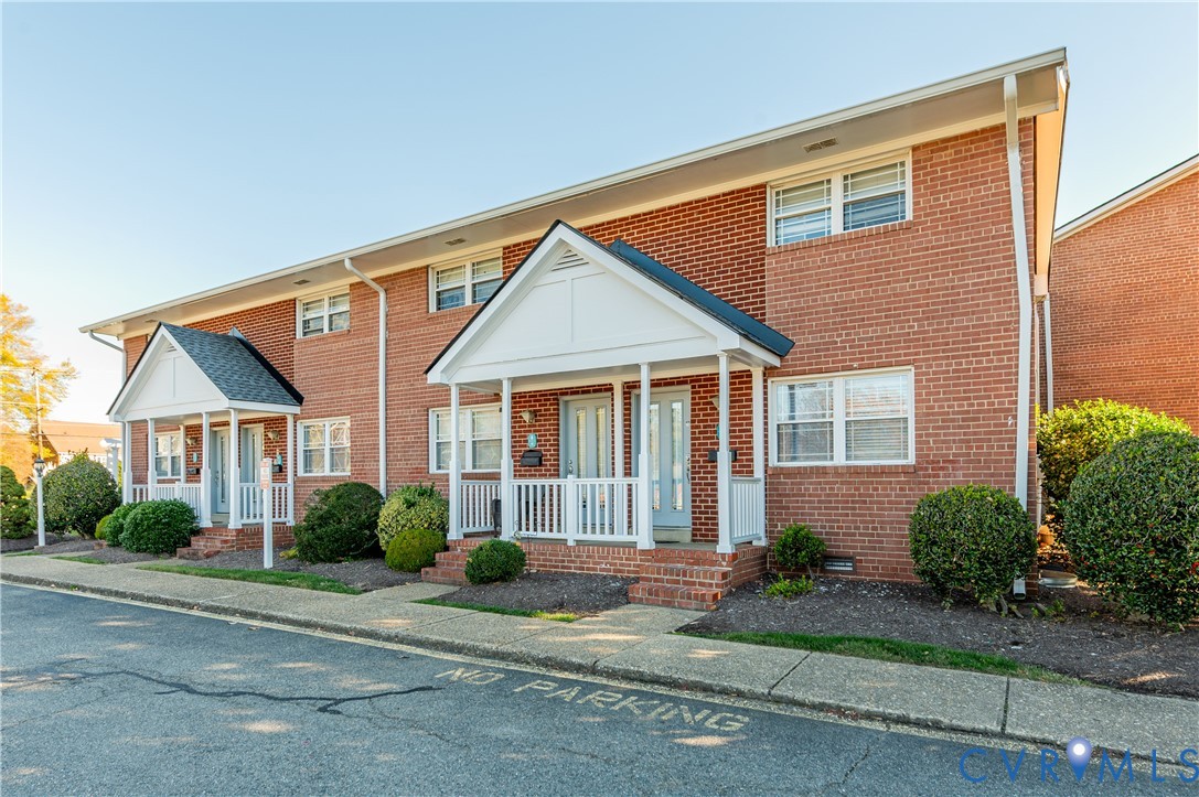 3109 North Parham Road, Unit 9 Henrico, VA 23294 - Photo 3 of 19 Traditional-style house featuring brick siding and