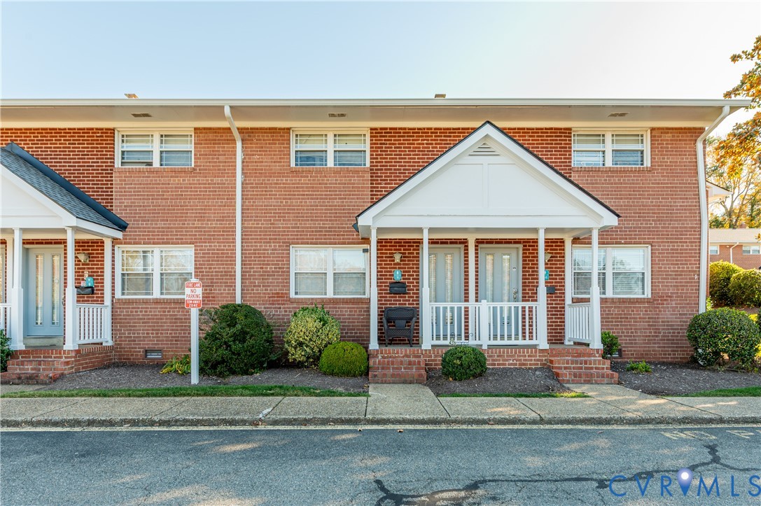 3109 North Parham Road, Unit 9 Henrico, VA 23294 - Photo 4 of 19 Traditional-style home featuring brick siding
