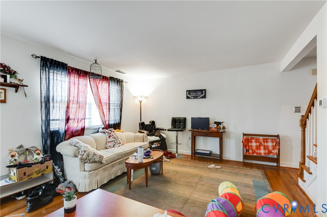3109 North Parham Road, Unit 9 Henrico, VA 23294 - Photo 6 of 19 Living area with stairway and wood finished floors