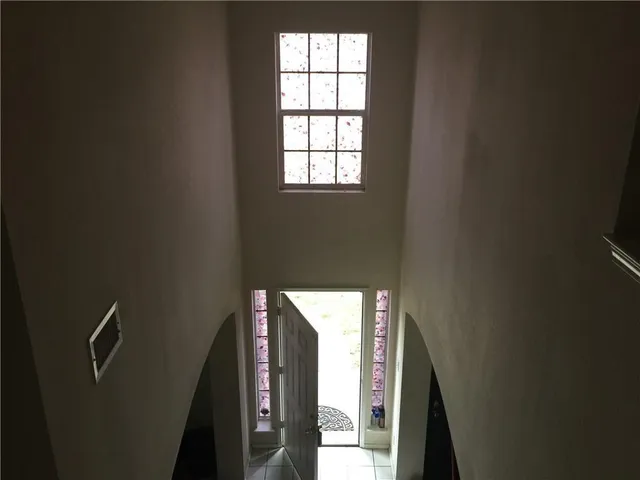 a view of an entryway with wooden floor