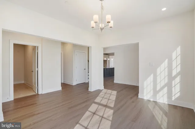 a view of livingroom with hardwood floor and hallway