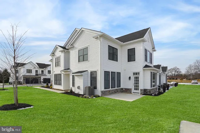 a front view of building with yard