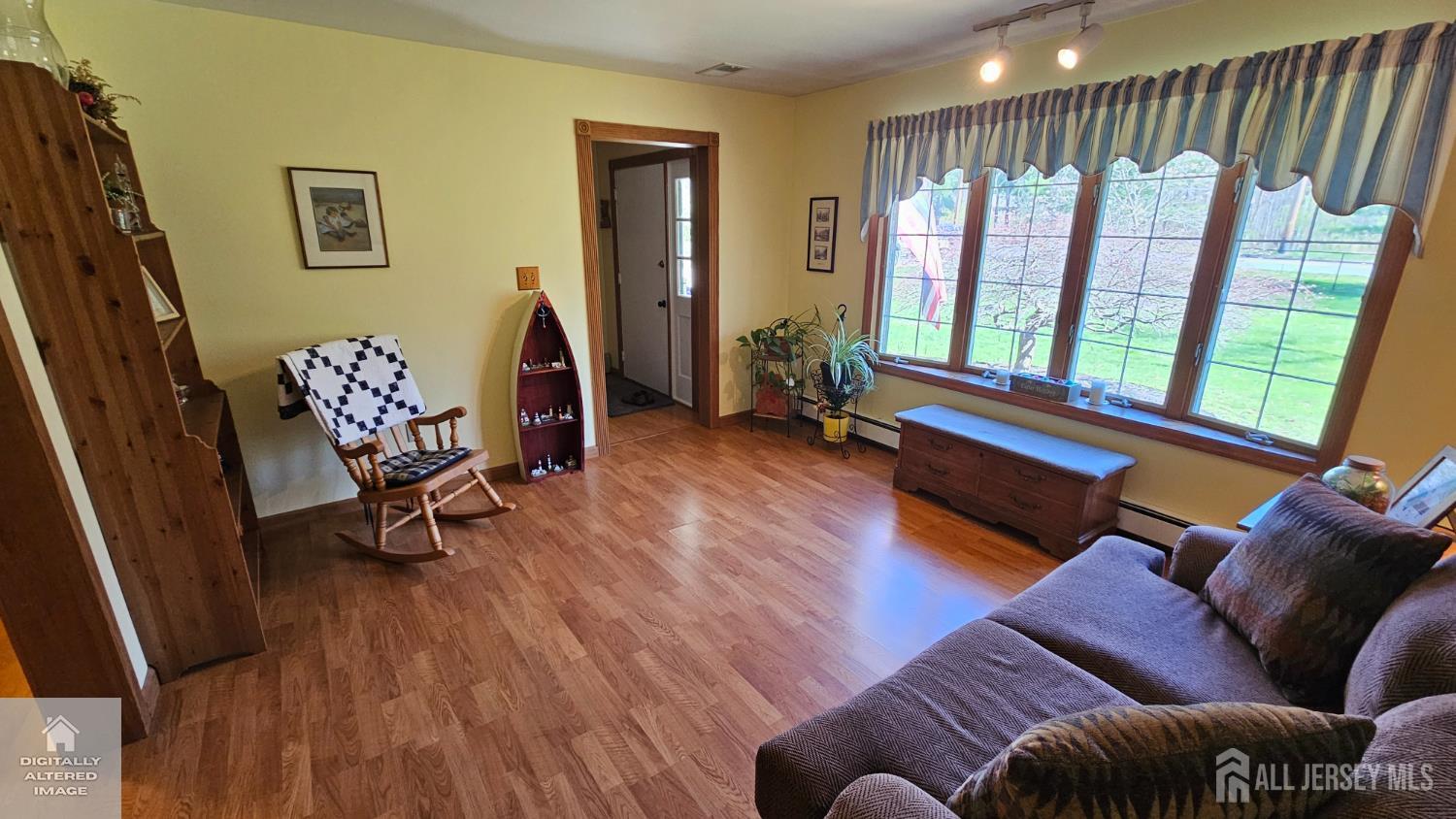 263 New Road Monmouth Junction, NJ 08852 - Photo 16 of 70 a living room with furniture and a wooden floor