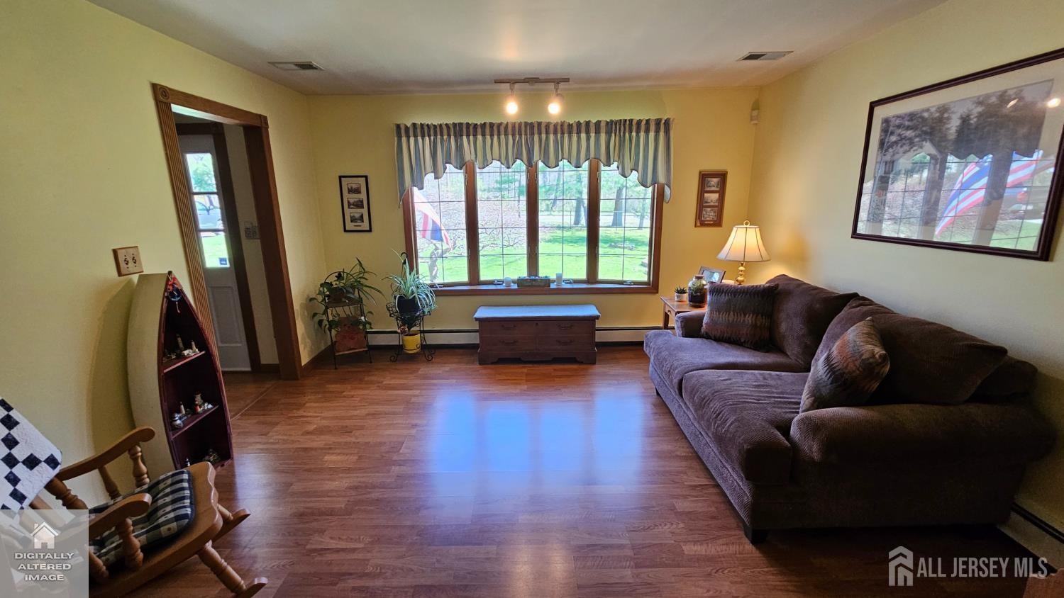 263 New Road Monmouth Junction, NJ 08852 - Photo 17 of 70 a living room with furniture and a flat screen tv