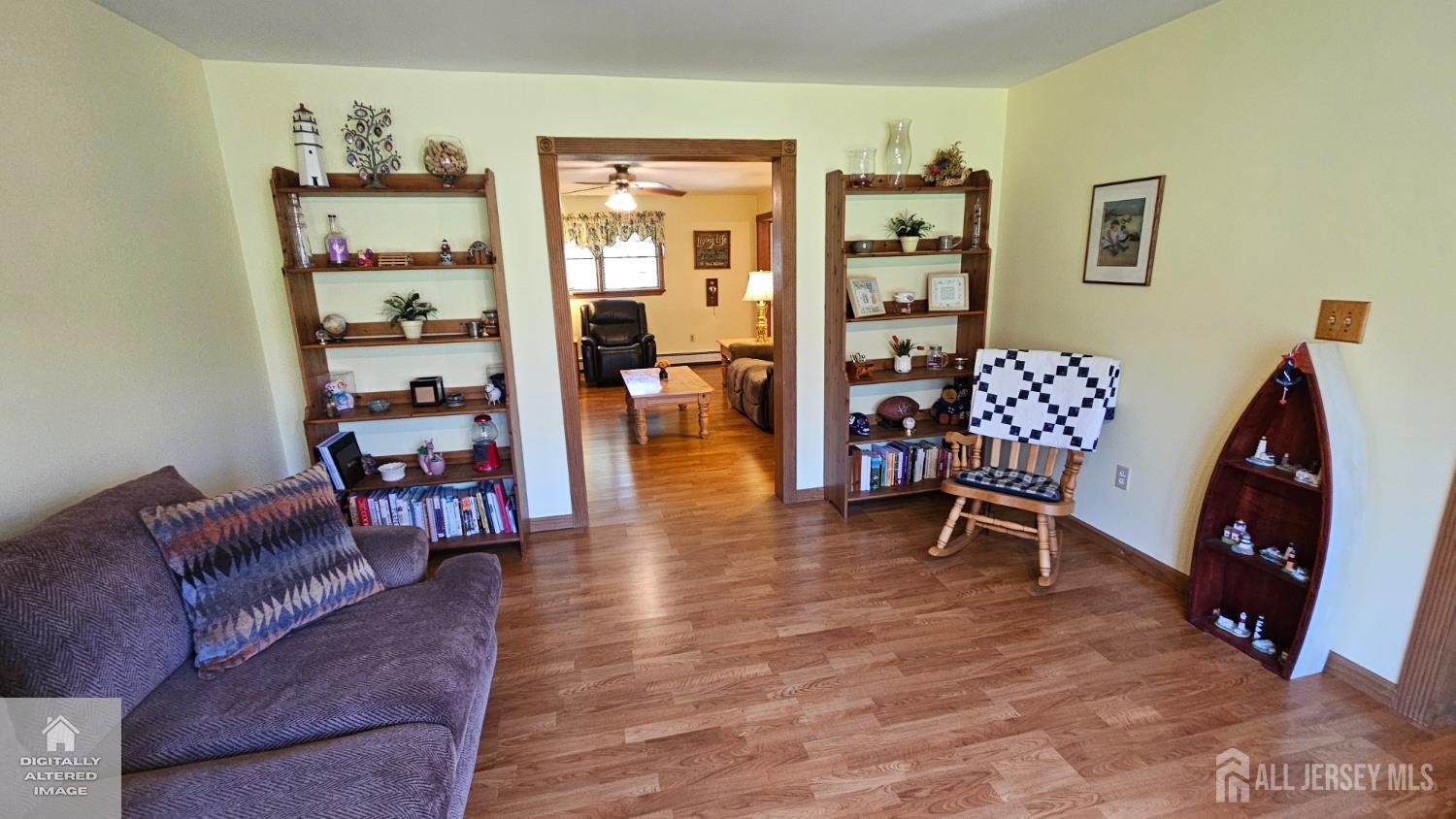 263 New Road Monmouth Junction, NJ 08852 - Photo 18 of 70 a living room with furniture and a wooden floor