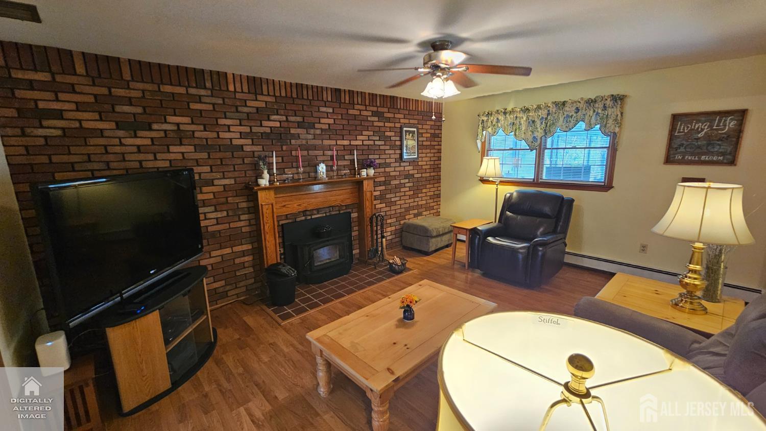 263 New Road Monmouth Junction, NJ 08852 - Photo 20 of 70 a living room with furniture a fireplace and a flat screen tv