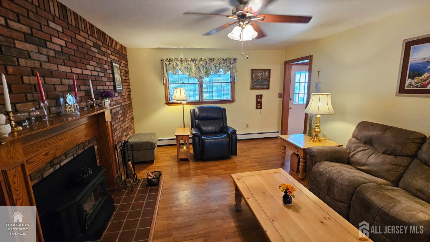 263 New Road Monmouth Junction, NJ 08852 - Photo 21 of 70 a living room with furniture and a flat screen tv