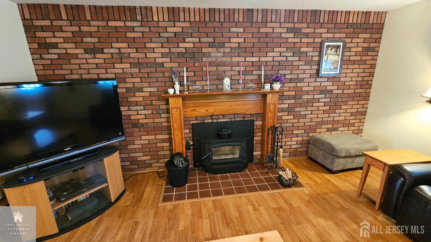 263 New Road Monmouth Junction, NJ 08852 - Photo 22 of 70 a living room with a fireplace wooden floor and a rug