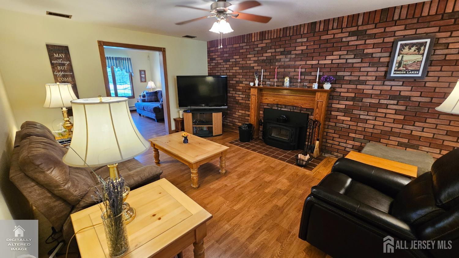 263 New Road Monmouth Junction, NJ 08852 - Photo 23 of 70 a living room with furniture and a flat screen tv