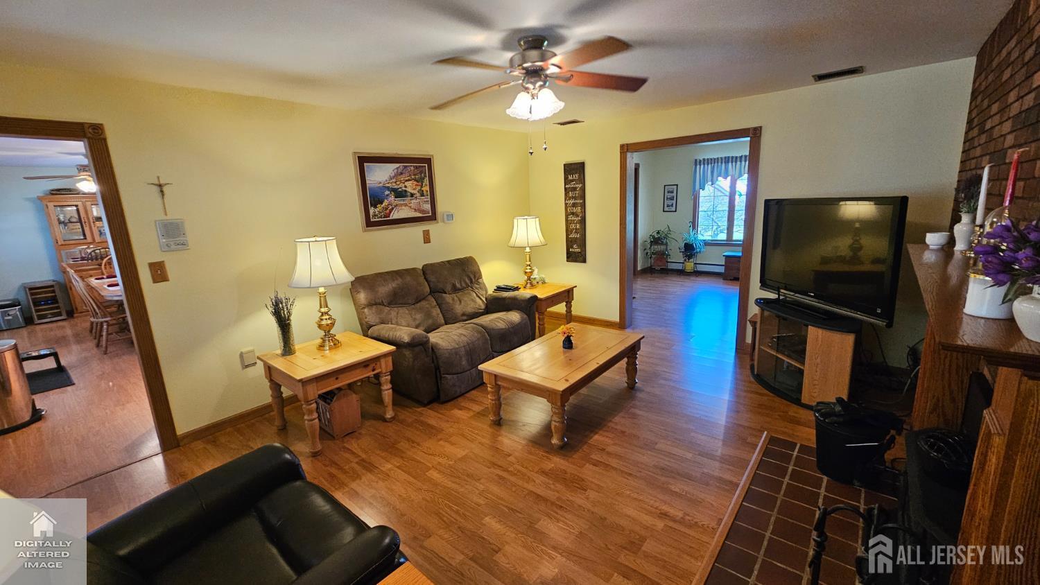 263 New Road Monmouth Junction, NJ 08852 - Photo 25 of 70 a living room with furniture and a flat screen tv