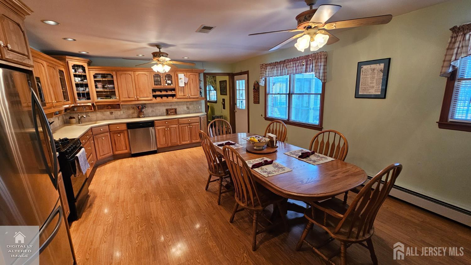 263 New Road Monmouth Junction, NJ 08852 - Photo 28 of 70 a view of a dining room with furniture and wooden floor