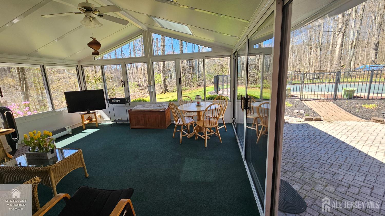 263 New Road Monmouth Junction, NJ 08852 - Photo 32 of 70 a living room with furniture and a floor to ceiling window
