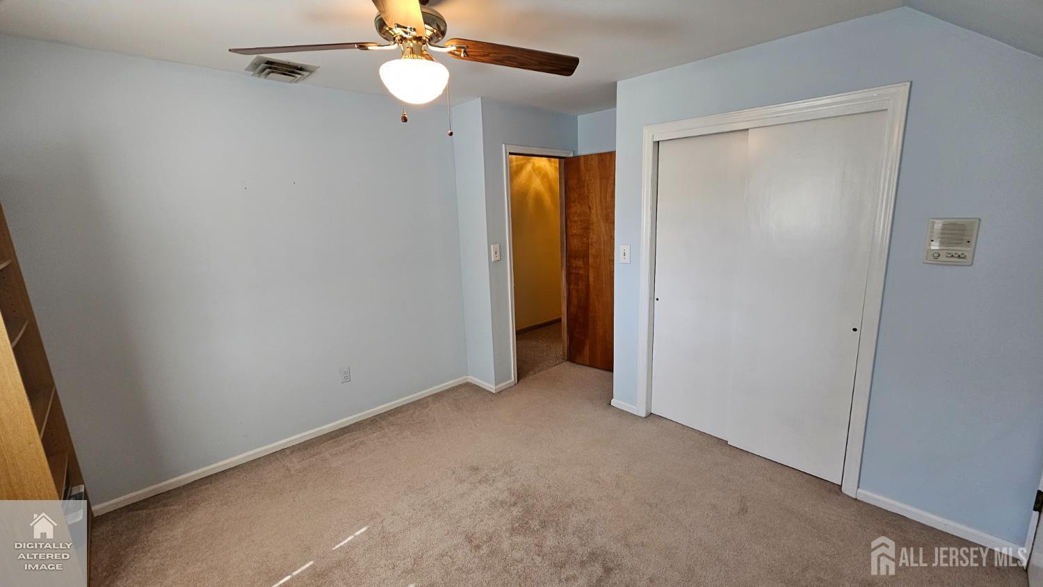 263 New Road Monmouth Junction, NJ 08852 - Photo 40 of 70 a view of an empty room with a ceiling fan and window