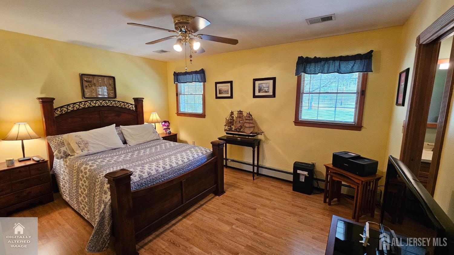263 New Road Monmouth Junction, NJ 08852 - Photo 42 of 70 a bedroom with a bed and wooden floor