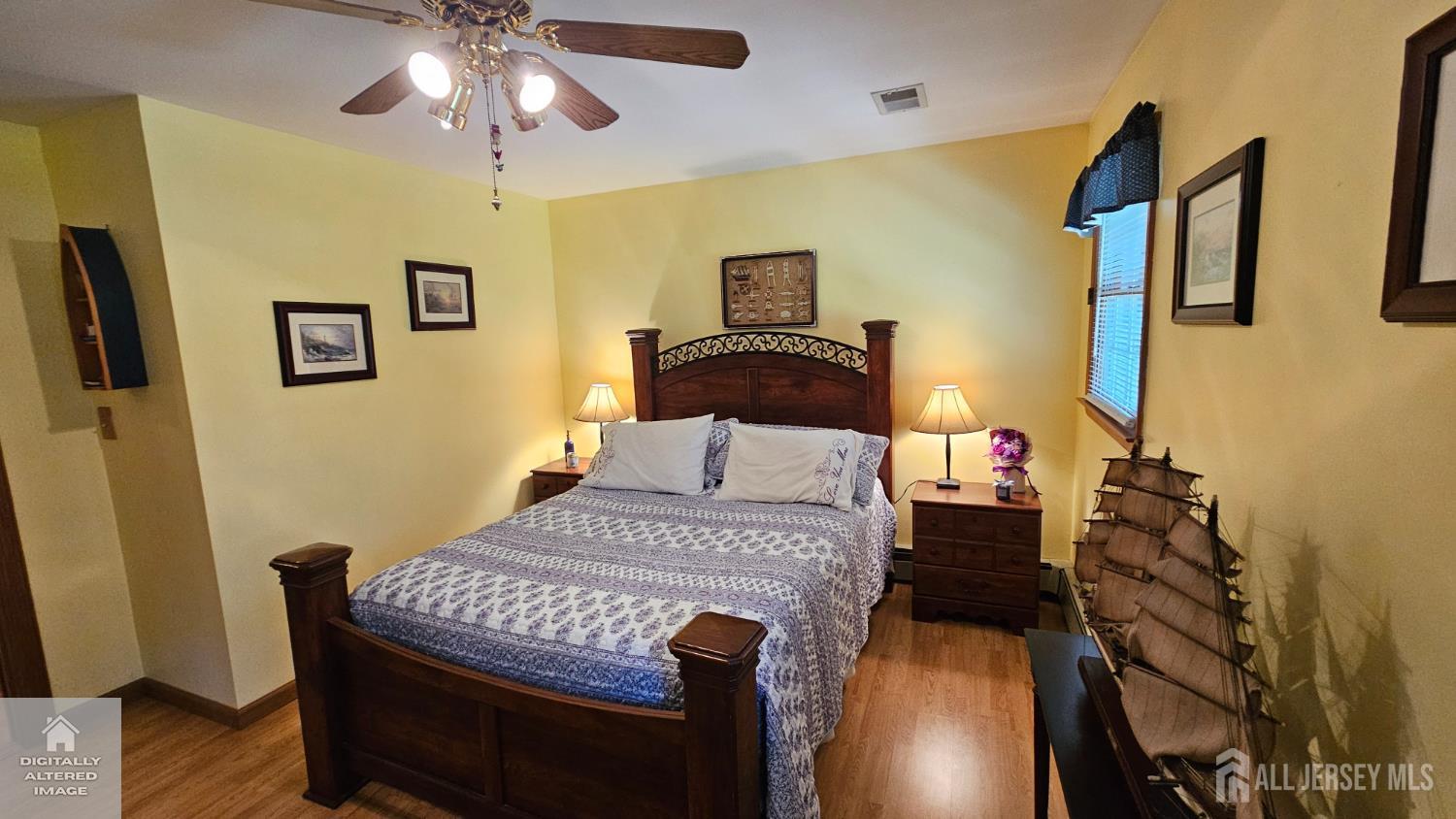 263 New Road Monmouth Junction, NJ 08852 - Photo 43 of 70 a bedroom with a bed and wooden floor