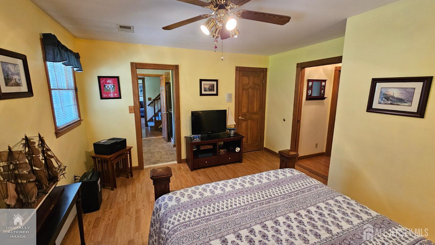 263 New Road Monmouth Junction, NJ 08852 - Photo 44 of 70 a bedroom with a bed and a chandelier