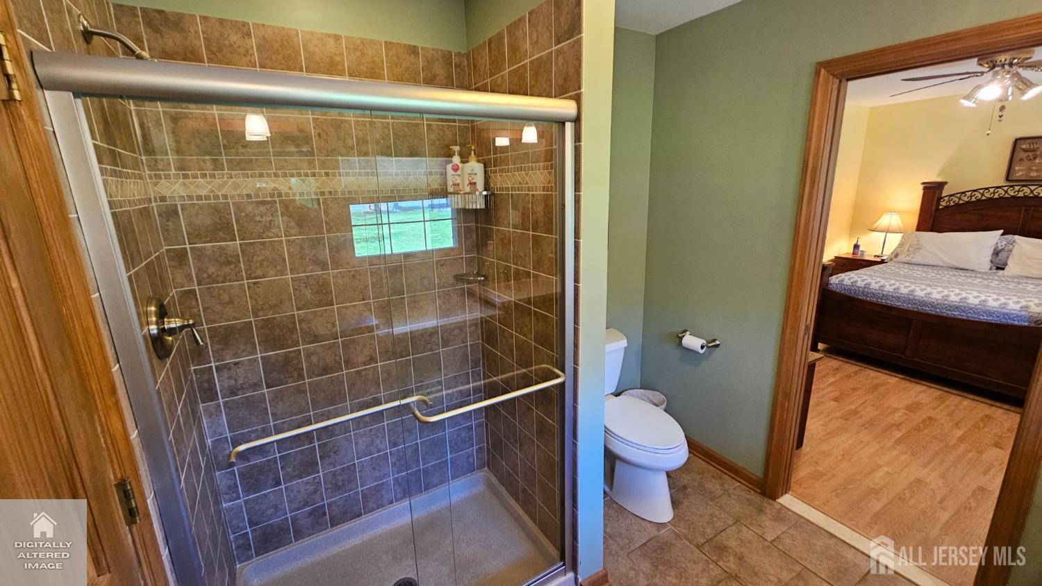 263 New Road Monmouth Junction, NJ 08852 - Photo 47 of 70 a bathroom with a granite countertop shower a toilet and a sink