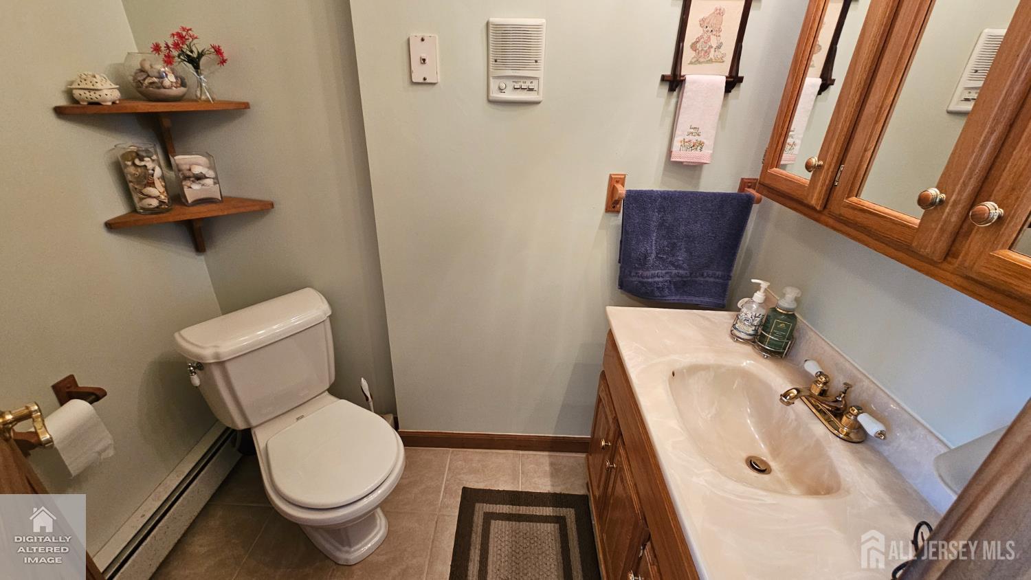 263 New Road Monmouth Junction, NJ 08852 - Photo 50 of 70 a bathroom with a sink toilet and a mirror