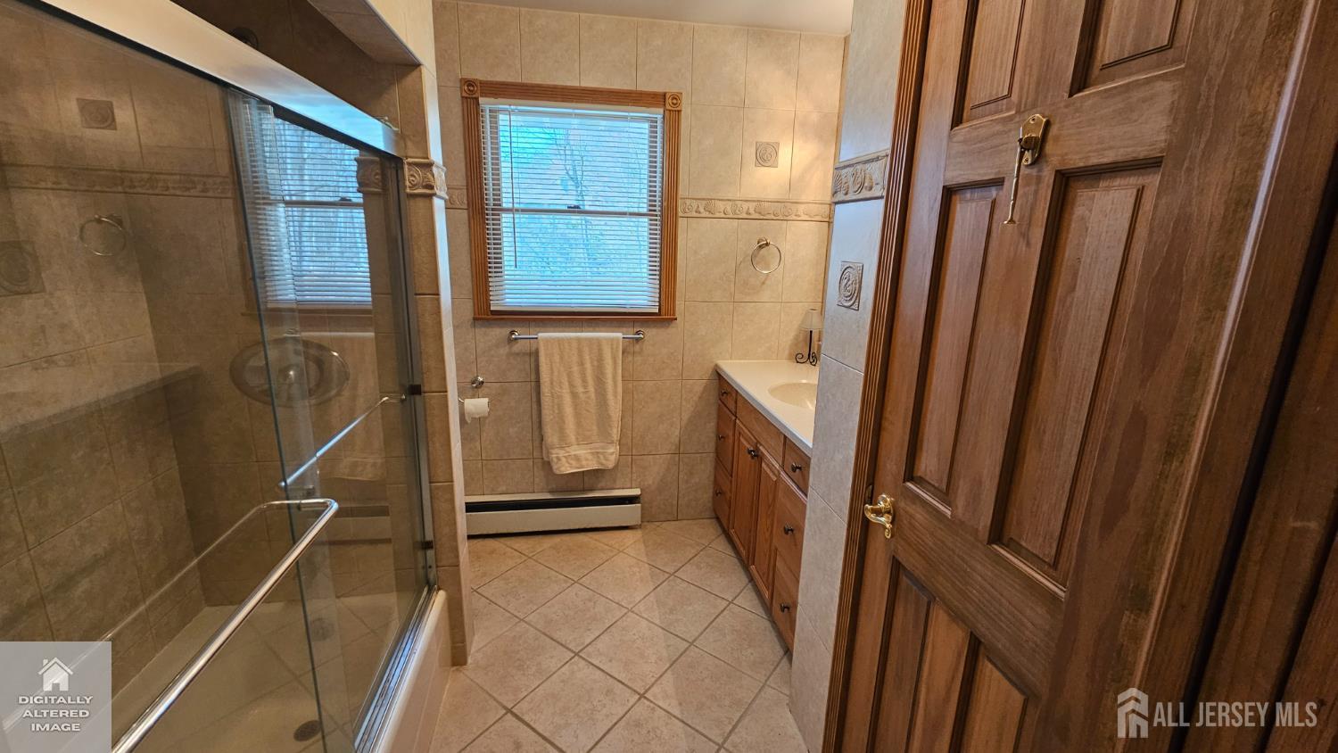 263 New Road Monmouth Junction, NJ 08852 - Photo 67 of 70 a bathroom with a sink a toilet and a shower
