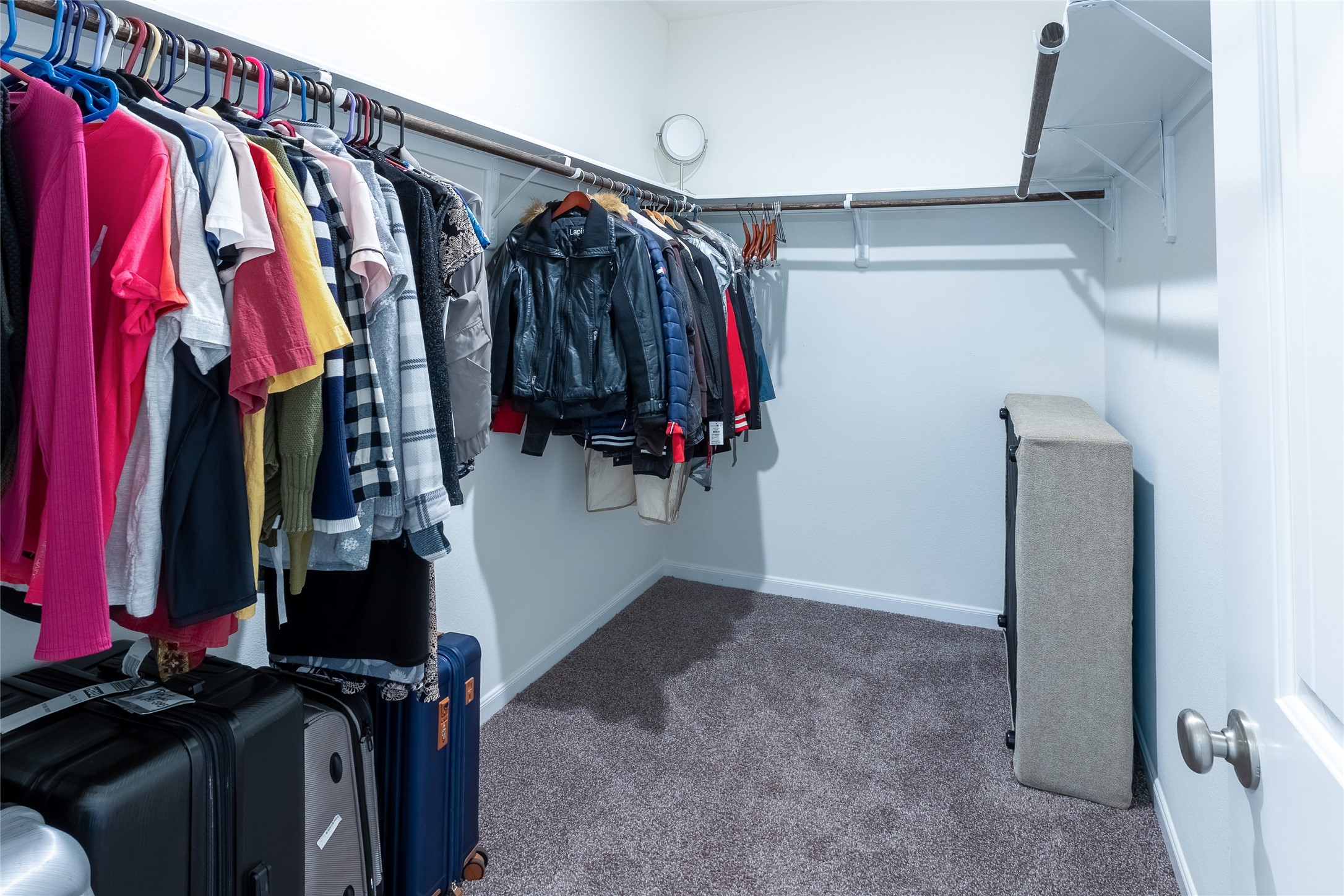 120 Sanctuary Road Huntsville, TX 77340 - Photo 27 of 38 a view of walk in closet with clothes