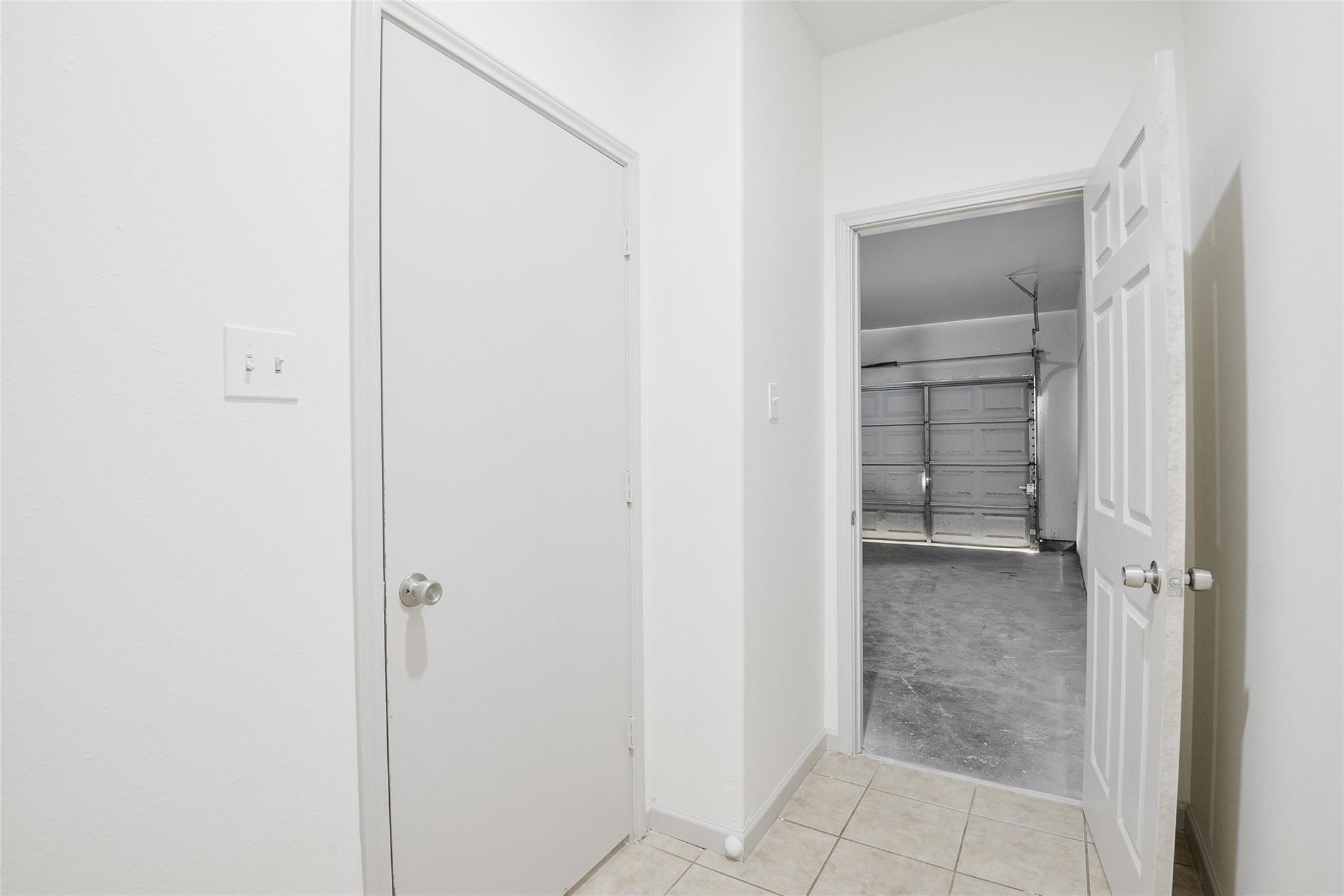 6627 Stonecross Creek Lane Katy, TX 77449 - Photo 12 of 30 a view of an empty walk in closet with living room in background