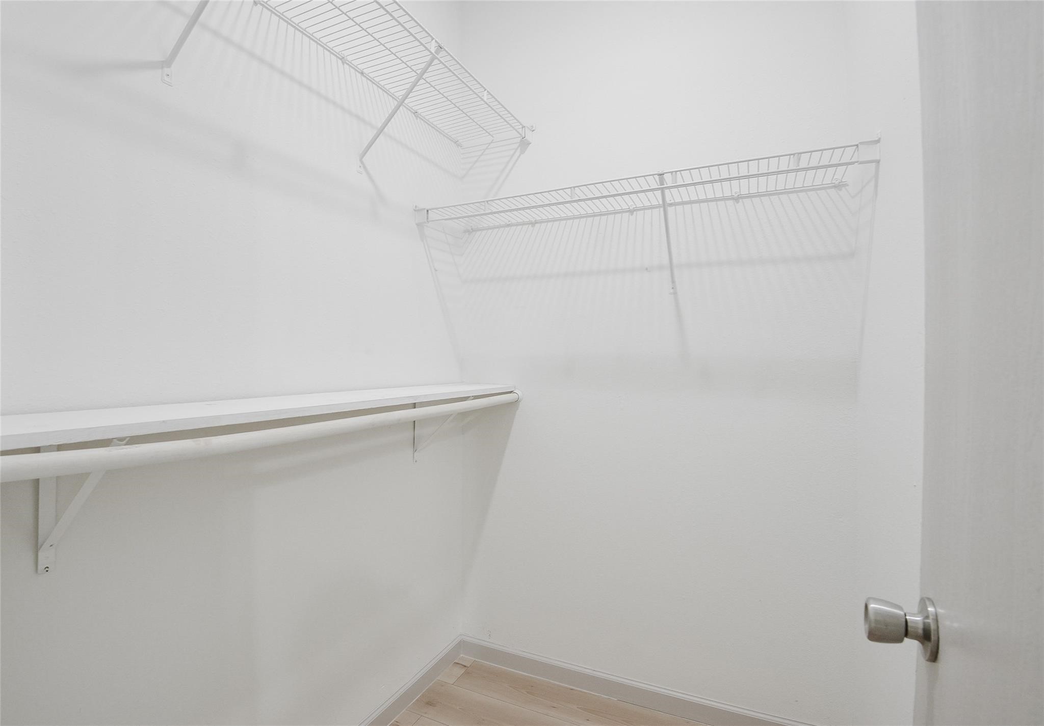 6627 Stonecross Creek Lane Katy, TX 77449 - Photo 19 of 30 a view of a room with racks on the wall