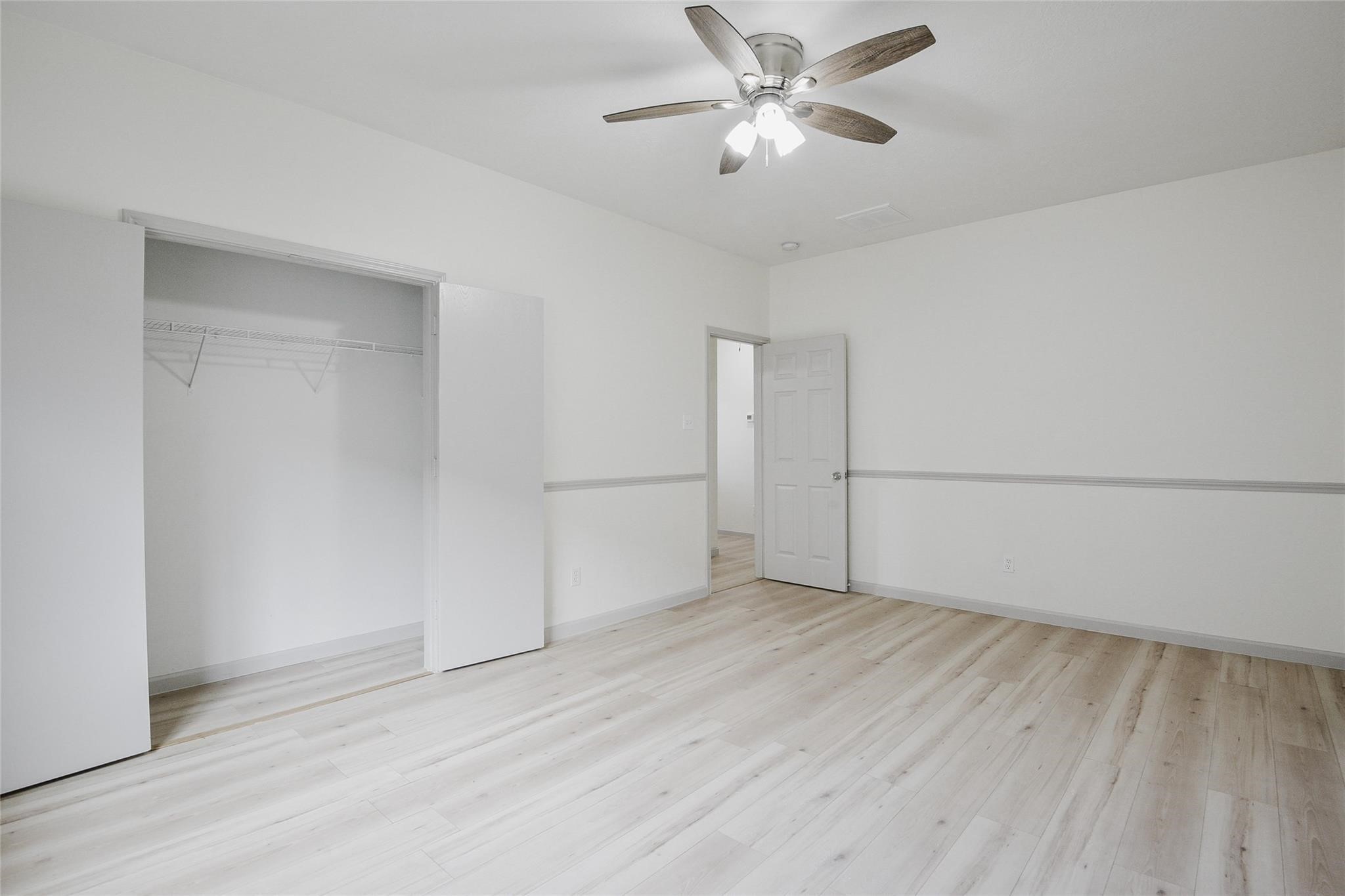 6627 Stonecross Creek Lane Katy, TX 77449 - Photo 22 of 30 a view of empty room with wooden floor