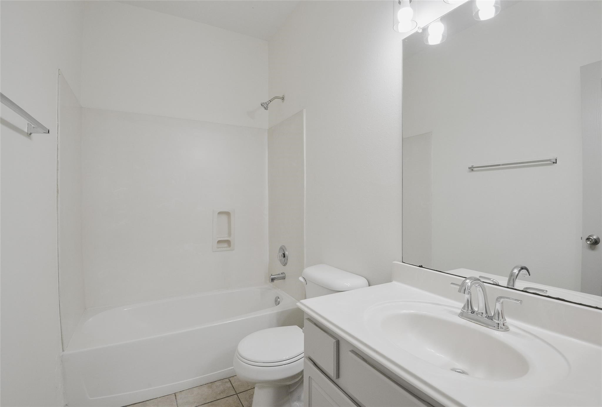 6627 Stonecross Creek Lane Katy, TX 77449 - Photo 26 of 30 a bathroom with a sink toilet and shower