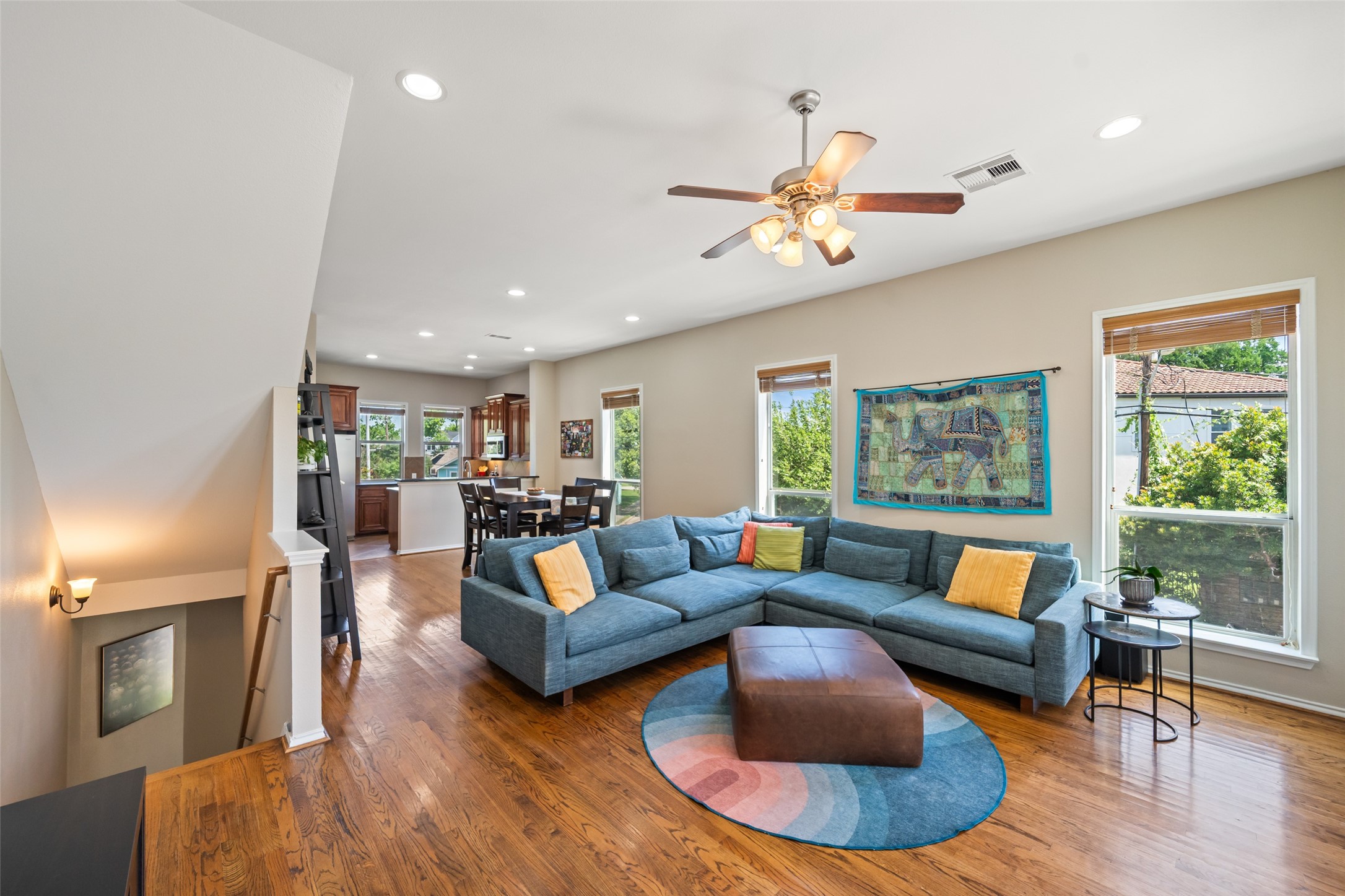 2613 Link Road Houston, TX 77009 - Photo 2 of 28 The 2nd floor living room is open to the dining and kitchen, features high ceilings, wood floors, and abundant windows.