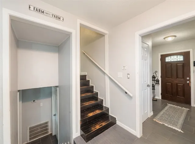 a view of an entryway with hallway