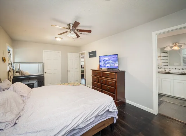 a bathroom with a sink and a mirror with toilet