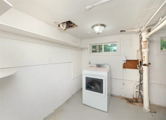 a view of a house with backyard and a patio